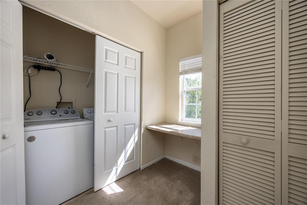 4872 Northwest 42nd Road, Unit 105 Gainesville, FL 32606 - Photo 18 of 38 a storage room with a washer and dryer