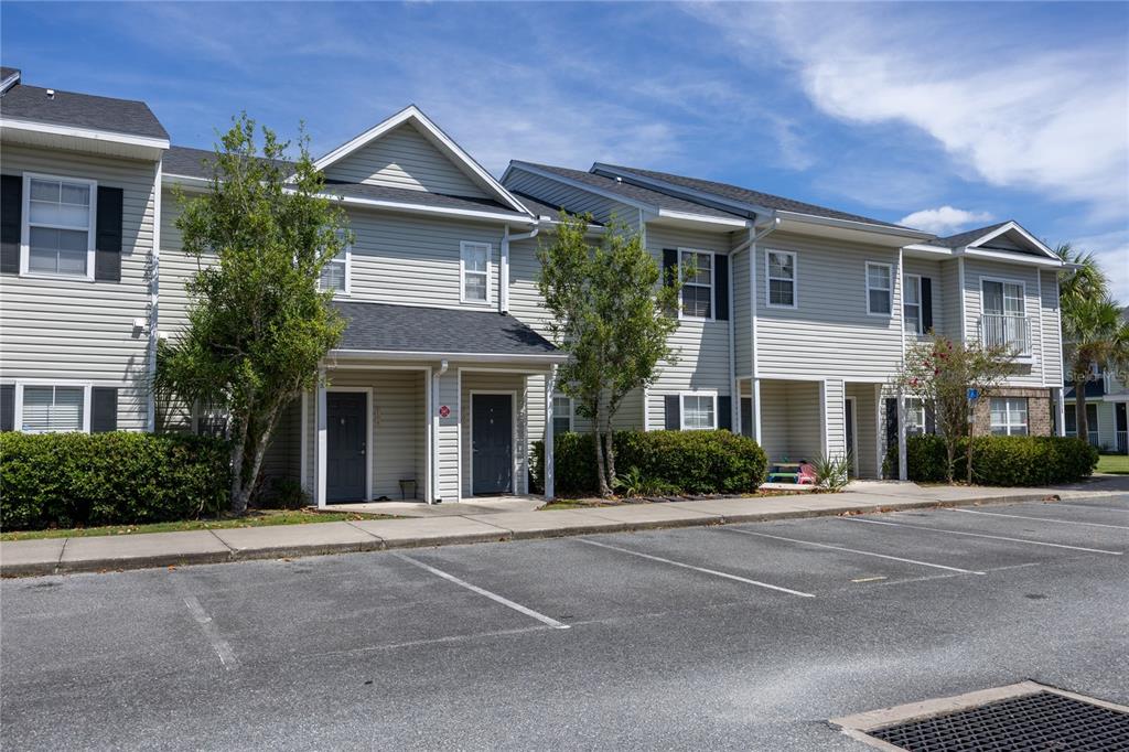 4872 Northwest 42nd Road, Unit 105 Gainesville, FL 32606 - Photo 2 of 38 front view of a house with a garden