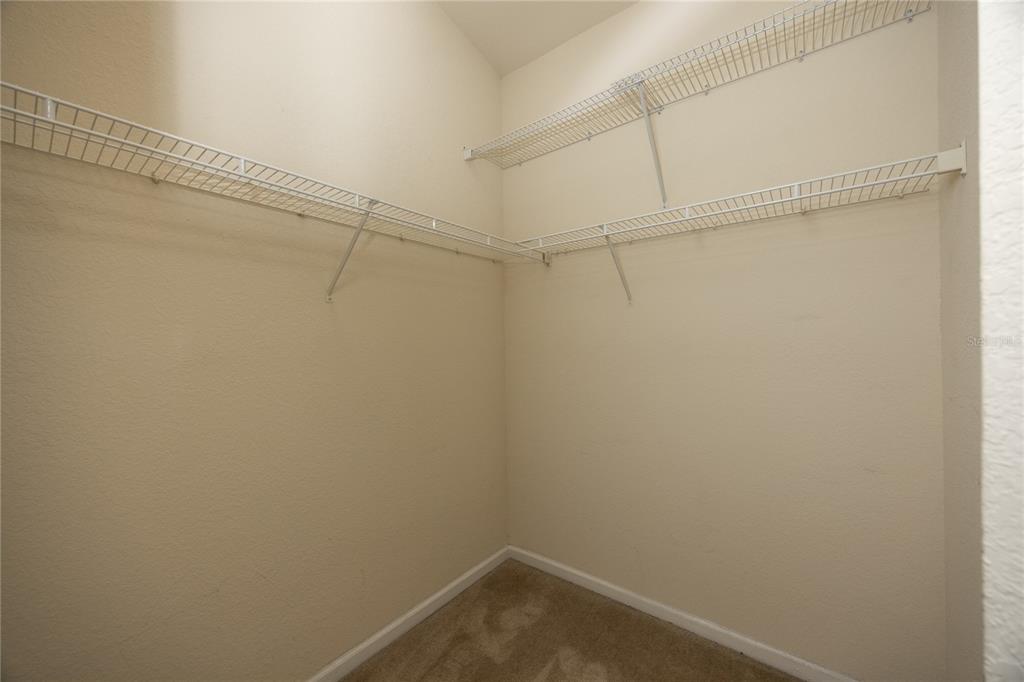 4872 Northwest 42nd Road, Unit 105 Gainesville, FL 32606 - Photo 22 of 38 a view of a room with racks on the wall