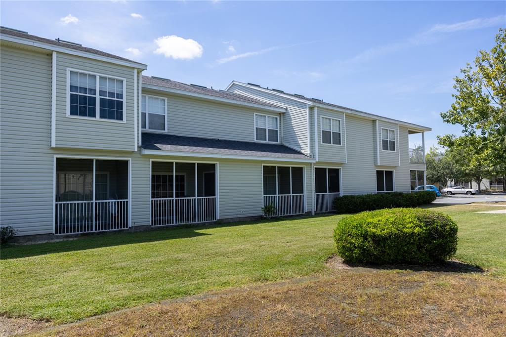 4872 Northwest 42nd Road, Unit 105 Gainesville, FL 32606 - Photo 29 of 38 a view of a house with a yard