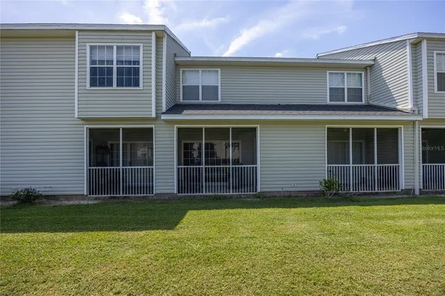 a view of a house with yard and garden