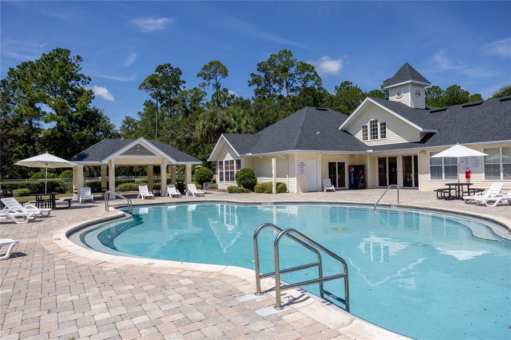 4872 Northwest 42nd Road, Unit 105 Gainesville, FL 32606 - Photo 34 of 38 a front view of house with outdoor space and swimming pool
