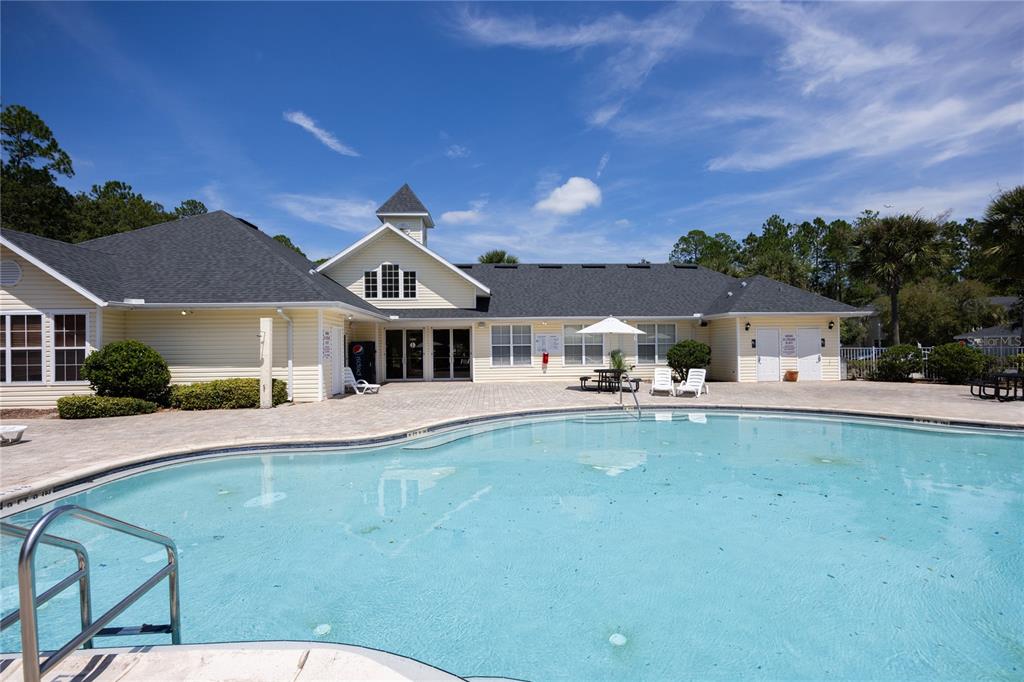 4872 Northwest 42nd Road, Unit 105 Gainesville, FL 32606 - Photo 35 of 38 a front view of a house with garden