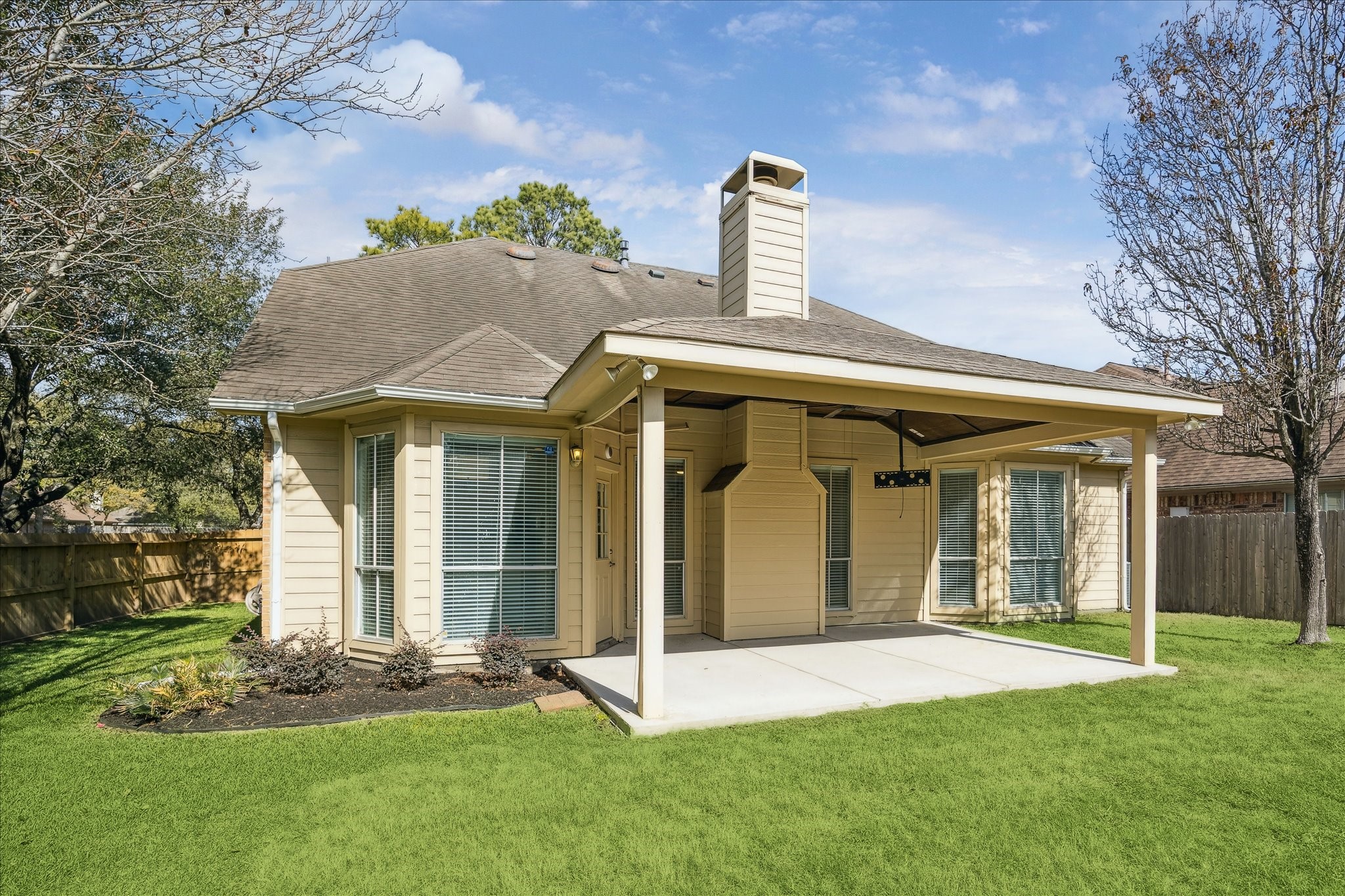 12831 Dove Point Lane Houston, TX 77041 - Photo 28 of 50 a front view of a house with a garden and yard