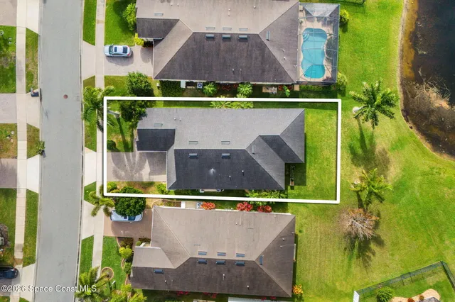 an aerial view of a house with a garden