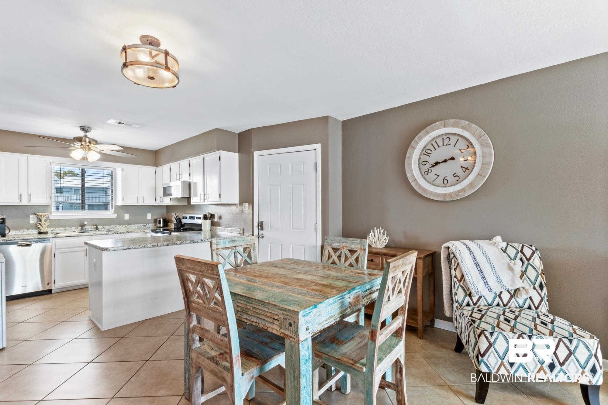 25925 -C Canal Road, Unit 203 Orange Beach, AL 36561 - Photo 4 of 57 Dining area with light tile patterned floors, sink, and ceiling fan