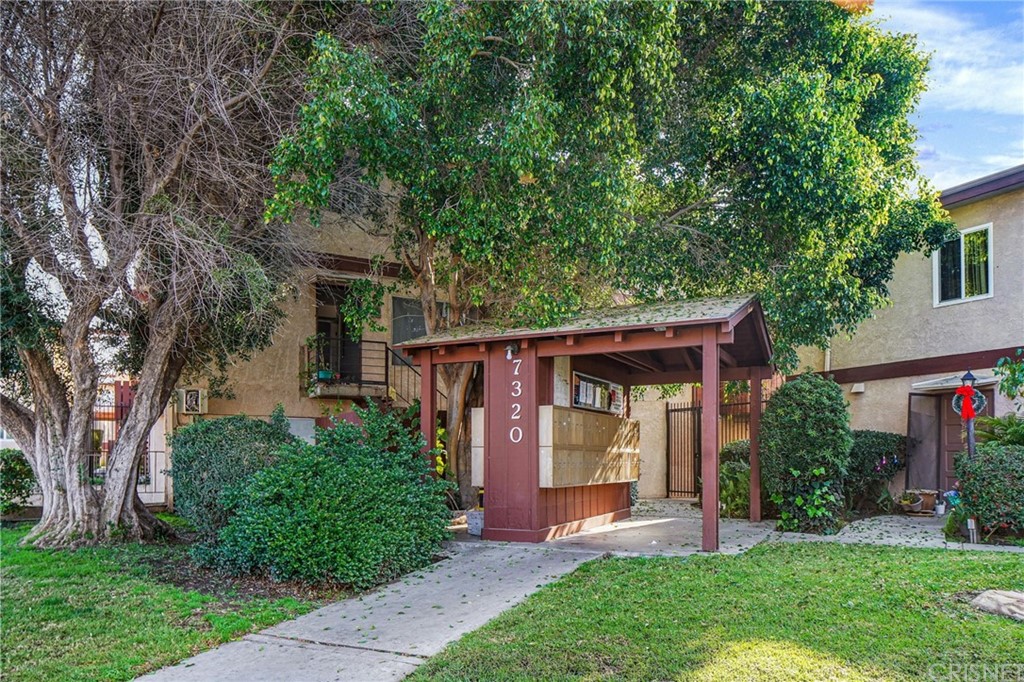 7320 Lennox Avenue, Unit H1 Van Nuys, CA 91405 - Photo 1 of 20 front view of a house with a yard