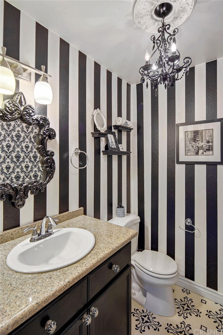7320 Lennox Avenue, Unit H1 Van Nuys, CA 91405 - Photo 11 of 20 a bathroom with a granite countertop sink toilet and shower
