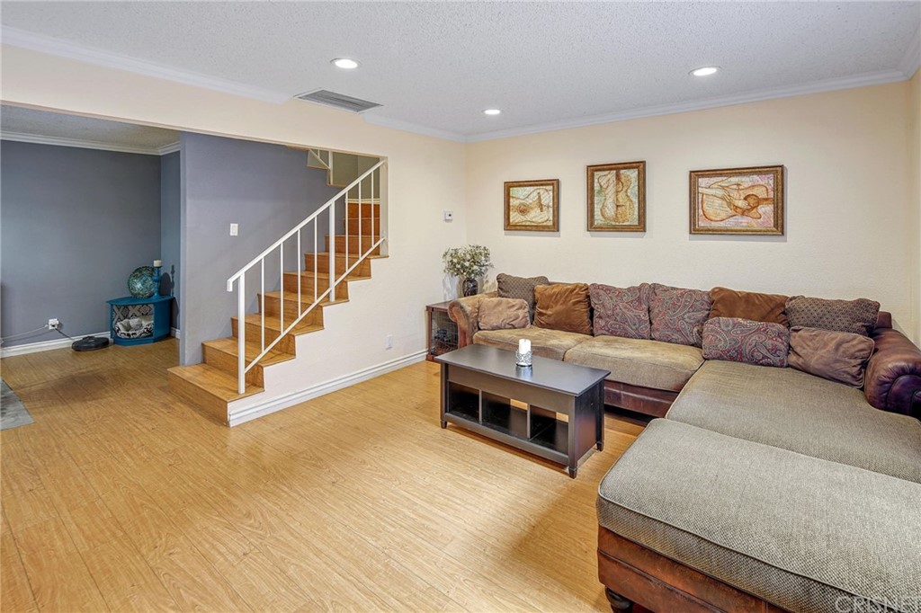 7320 Lennox Avenue, Unit H1 Van Nuys, CA 91405 - Photo 6 of 20 a living room with furniture and a wooden floor