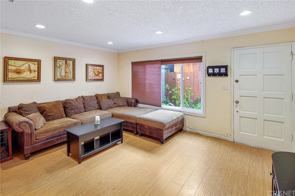 7320 Lennox Avenue, Unit H1 Van Nuys, CA 91405 - Photo 7 of 20 a living room with furniture and a window
