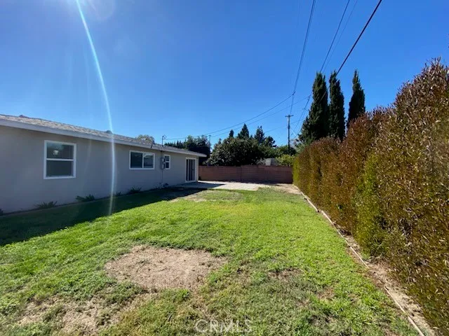 a view of a backyard of the house