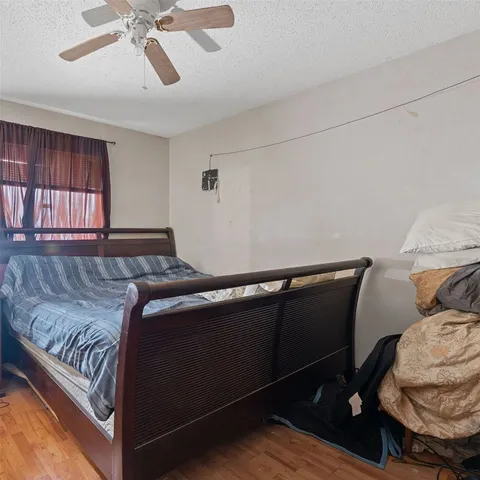 a bedroom with a bed and window