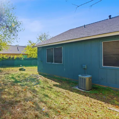a backyard of a house with lots of green space