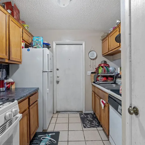 a kitchen with stainless steel appliances a stove and a refrigerator