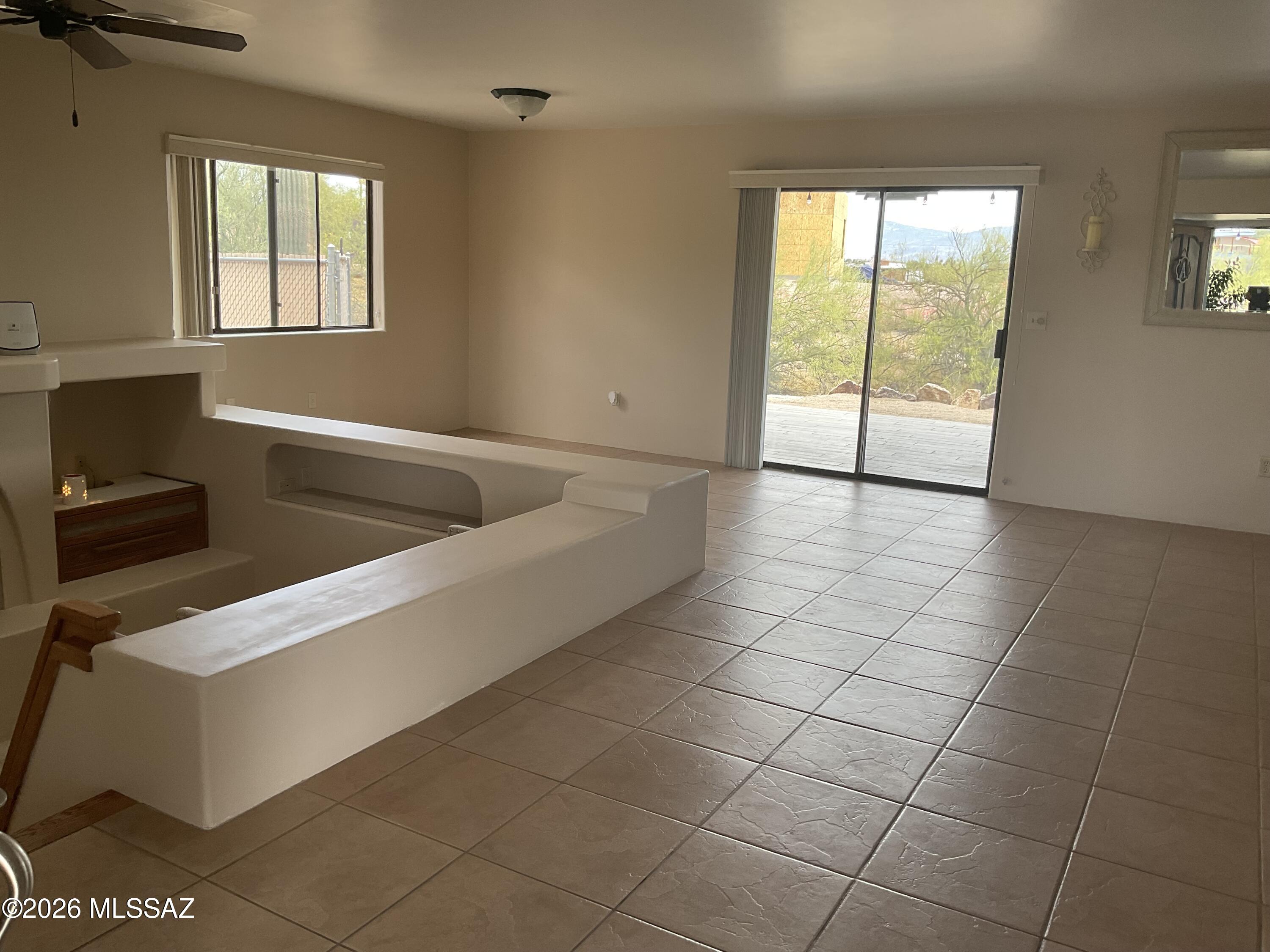 4060 North Swan Road Tucson, AZ 85718 - Photo 11 of 47 a living room with a baby crib furniture and a window