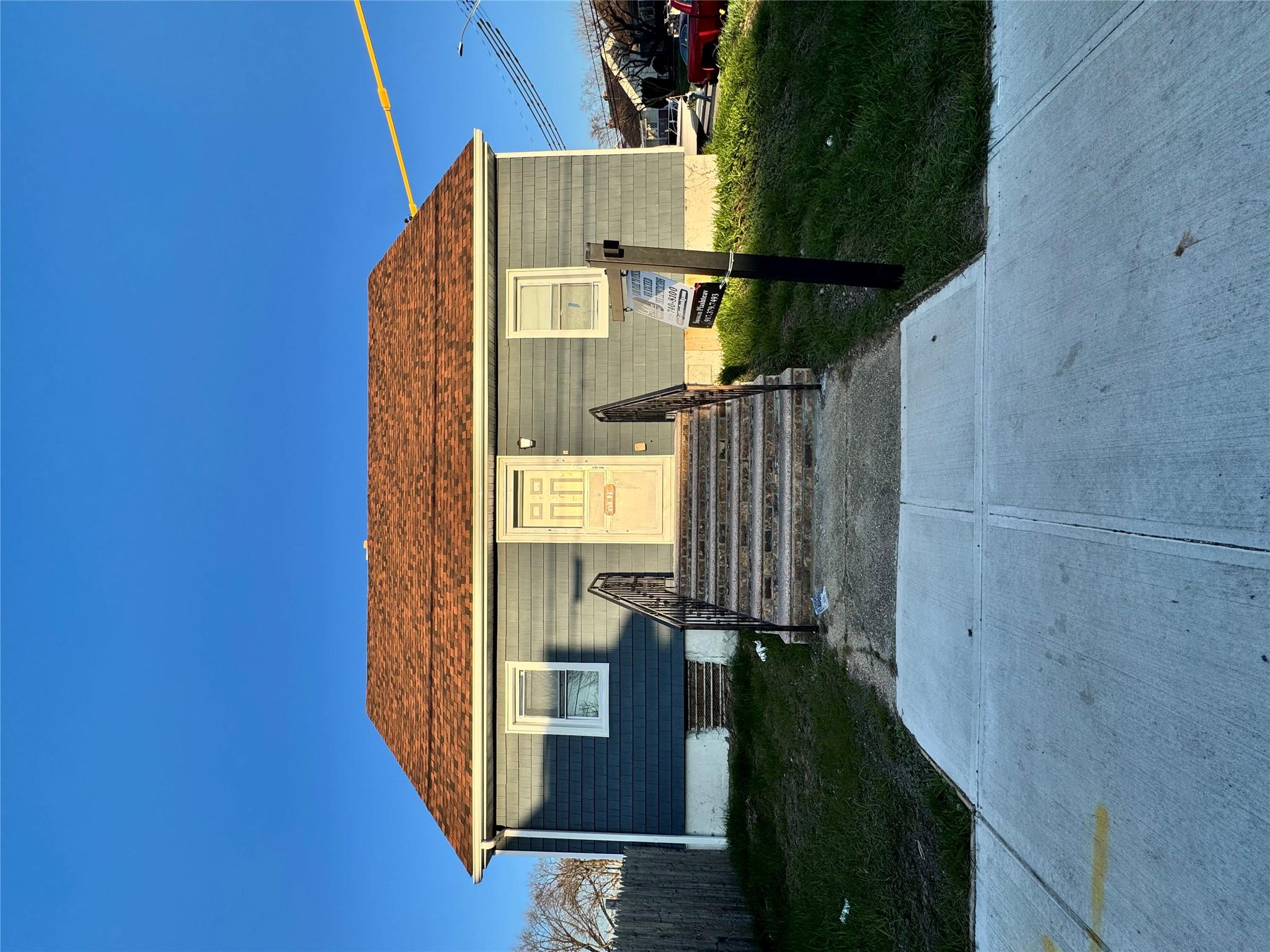 259-07 147th Road Queens, NY 11422 - Photo 24 of 24 View of front of property with entry steps and fence
