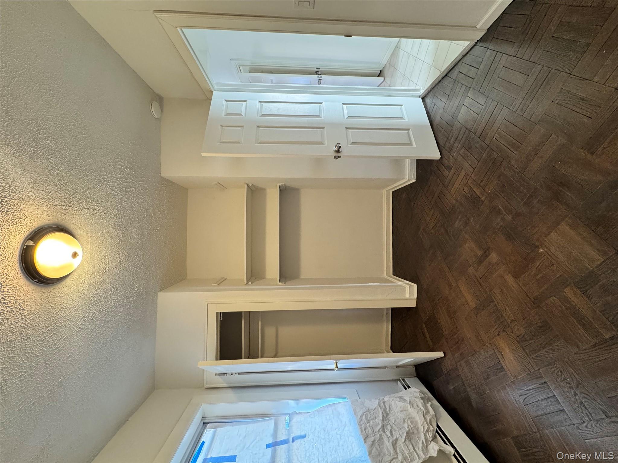 259-07 147th Road Queens, NY 11422 - Photo 6 of 27 2nd bedroom featuring baseboards, a textured ceiling, and a closet