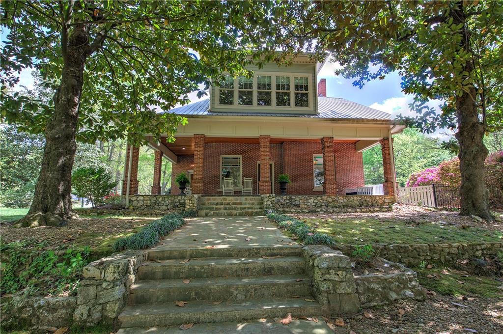421 Boulevard Heights Calhoun, GA 30701 - Photo 2 of 96 a front view of a house with a yard
