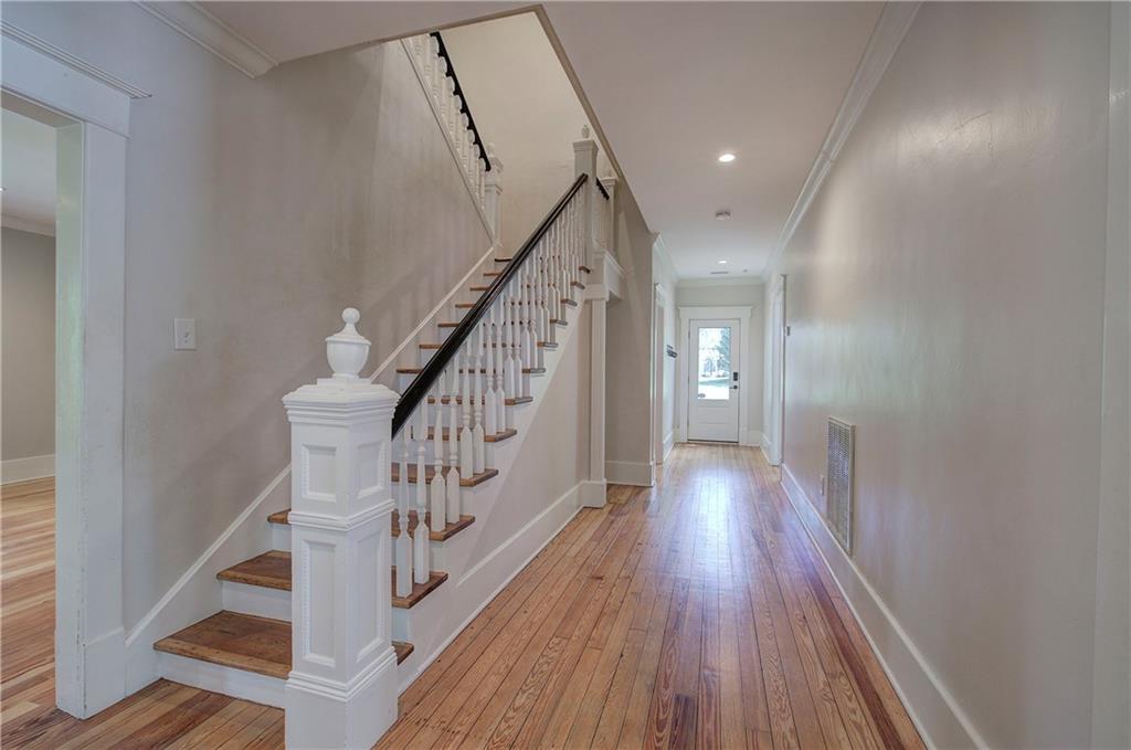 421 Boulevard Heights Calhoun, GA 30701 - Photo 30 of 96 a view of staircase with wooden floor and white walls