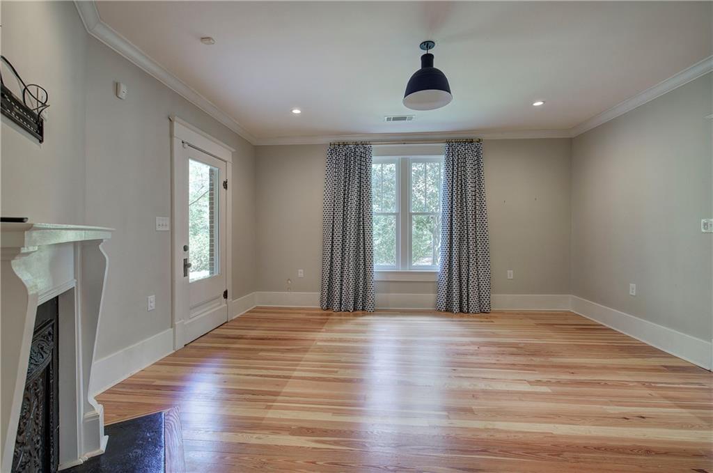 421 Boulevard Heights Calhoun, GA 30701 - Photo 32 of 96 a view of empty room with wooden floor and fan
