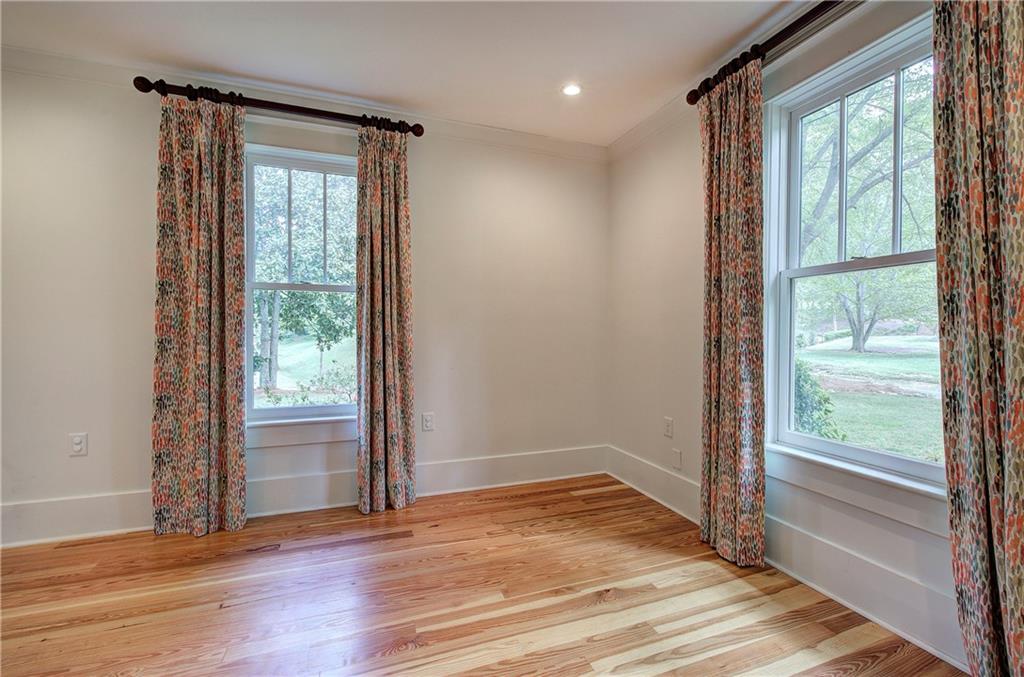 421 Boulevard Heights Calhoun, GA 30701 - Photo 37 of 96 a view of an empty room with wooden floor and a window