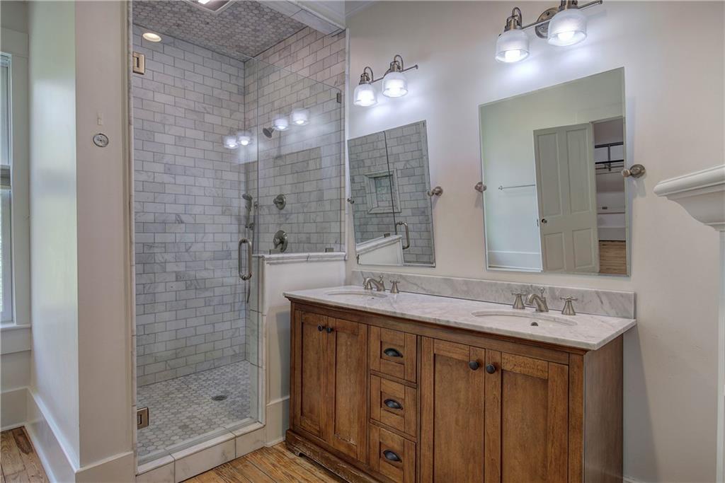 421 Boulevard Heights Calhoun, GA 30701 - Photo 49 of 96 a bathroom with a double vanity sink mirror and shower