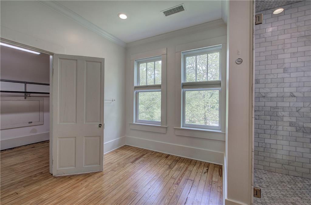 421 Boulevard Heights Calhoun, GA 30701 - Photo 50 of 96 a view of empty room with wooden floor and fan
