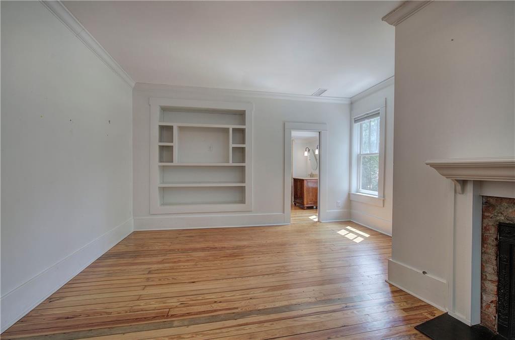 421 Boulevard Heights Calhoun, GA 30701 - Photo 55 of 96 a view of empty room with wooden floor and fireplace