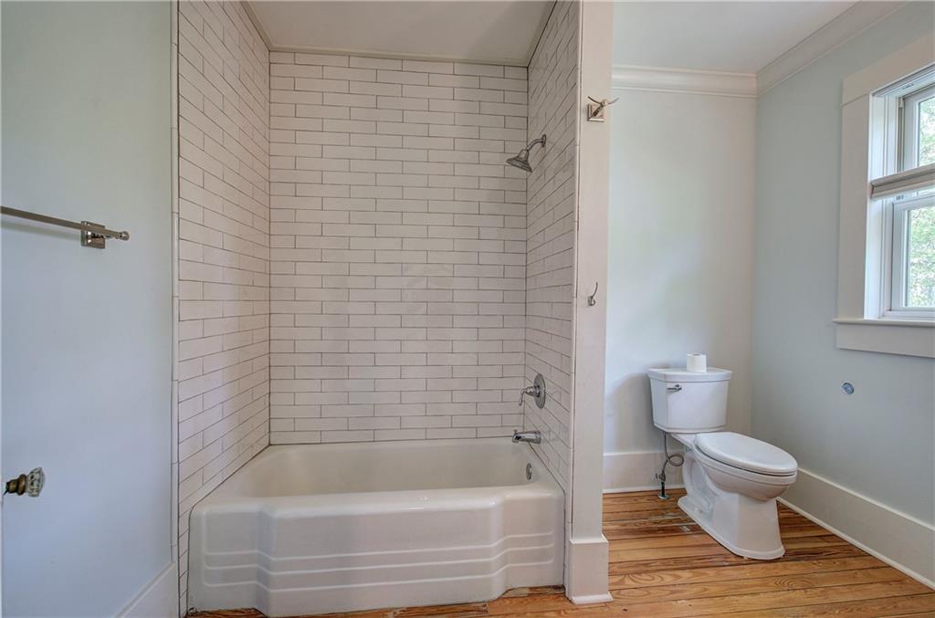 421 Boulevard Heights Calhoun, GA 30701 - Photo 64 of 96 a bathroom with a toilet and a bathtub