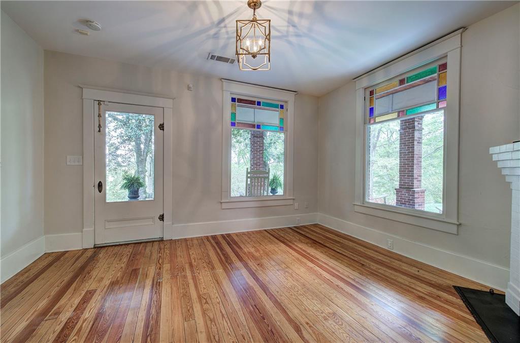 421 Boulevard Heights Calhoun, GA 30701 - Photo 67 of 96 a view of an empty room with wooden floor and a window