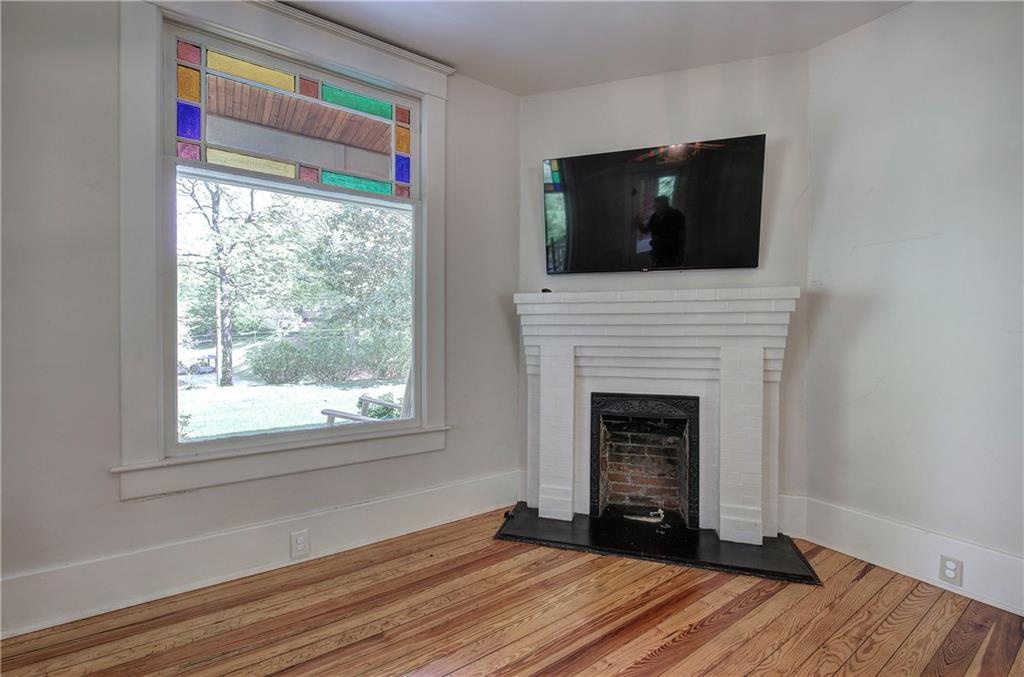 421 Boulevard Heights Calhoun, GA 30701 - Photo 71 of 96 a living room with a fireplace and a flat screen tv