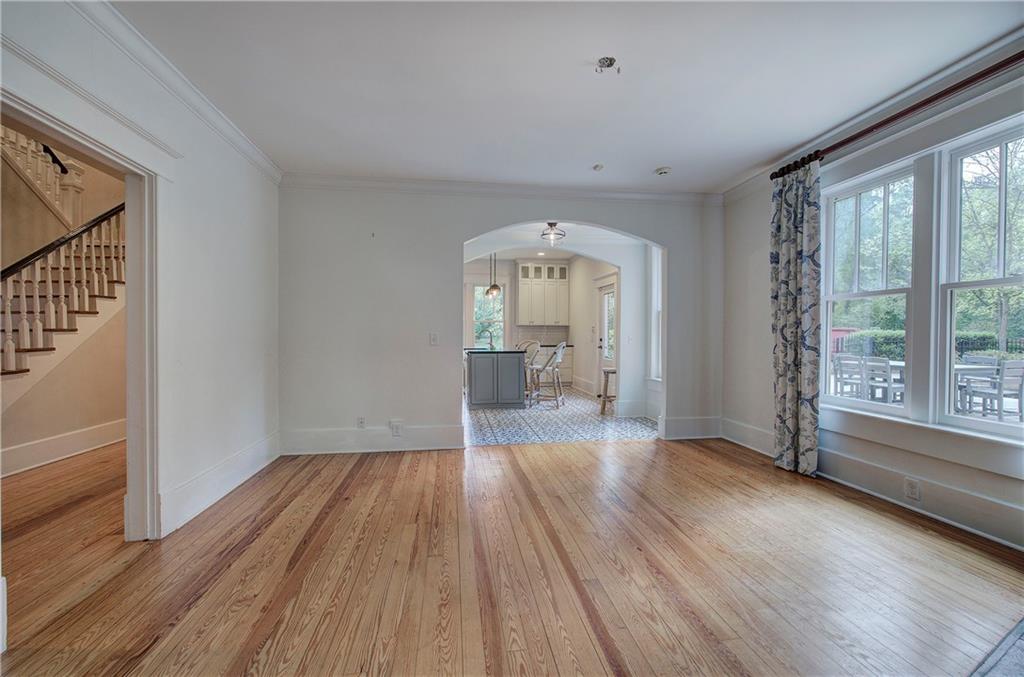 421 Boulevard Heights Calhoun, GA 30701 - Photo 75 of 96 a view of a big room with wooden floor a fireplace and windows