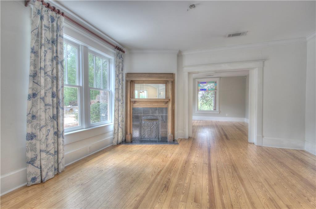 421 Boulevard Heights Calhoun, GA 30701 - Photo 77 of 96 a view of an empty room with wooden floor and a window