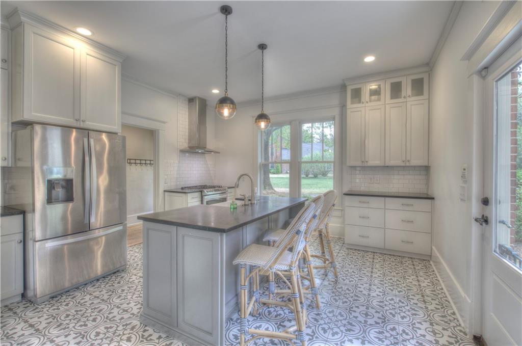 421 Boulevard Heights Calhoun, GA 30701 - Photo 81 of 96 a kitchen with kitchen island a counter top space appliances and cabinets