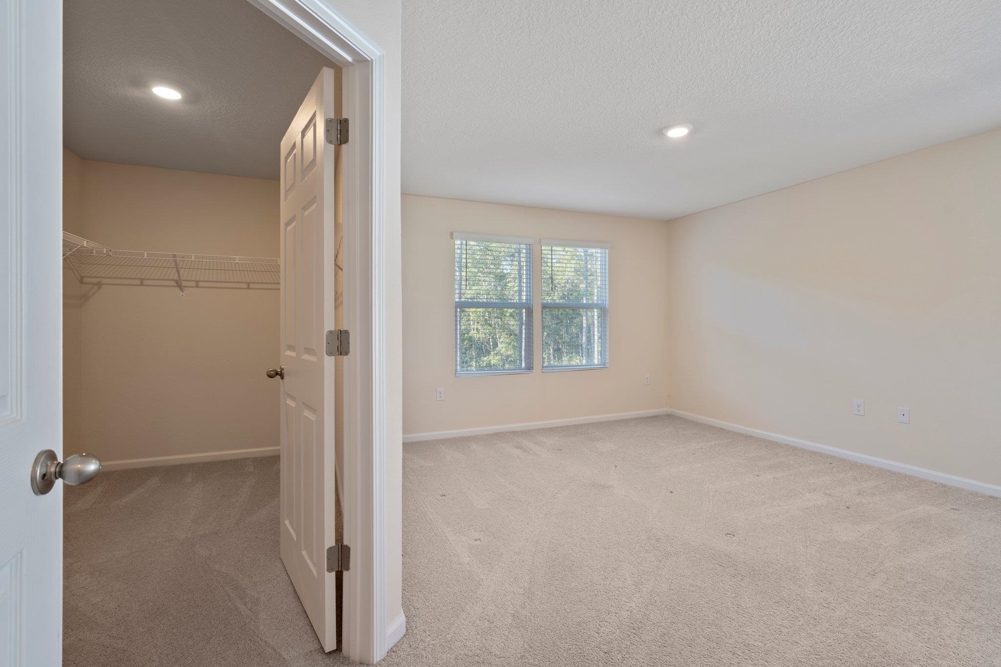 553 Coastline Way Street St. Augustine, FL 32092 - Photo 14 of 35 a view of an empty room with a window