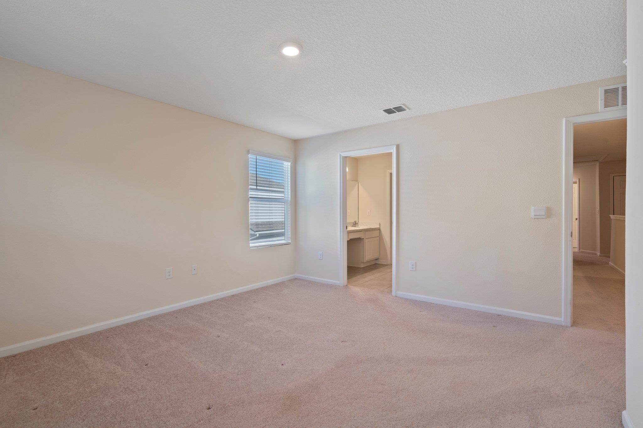 553 Coastline Way Street St. Augustine, FL 32092 - Photo 15 of 35 a view of an empty room and a window