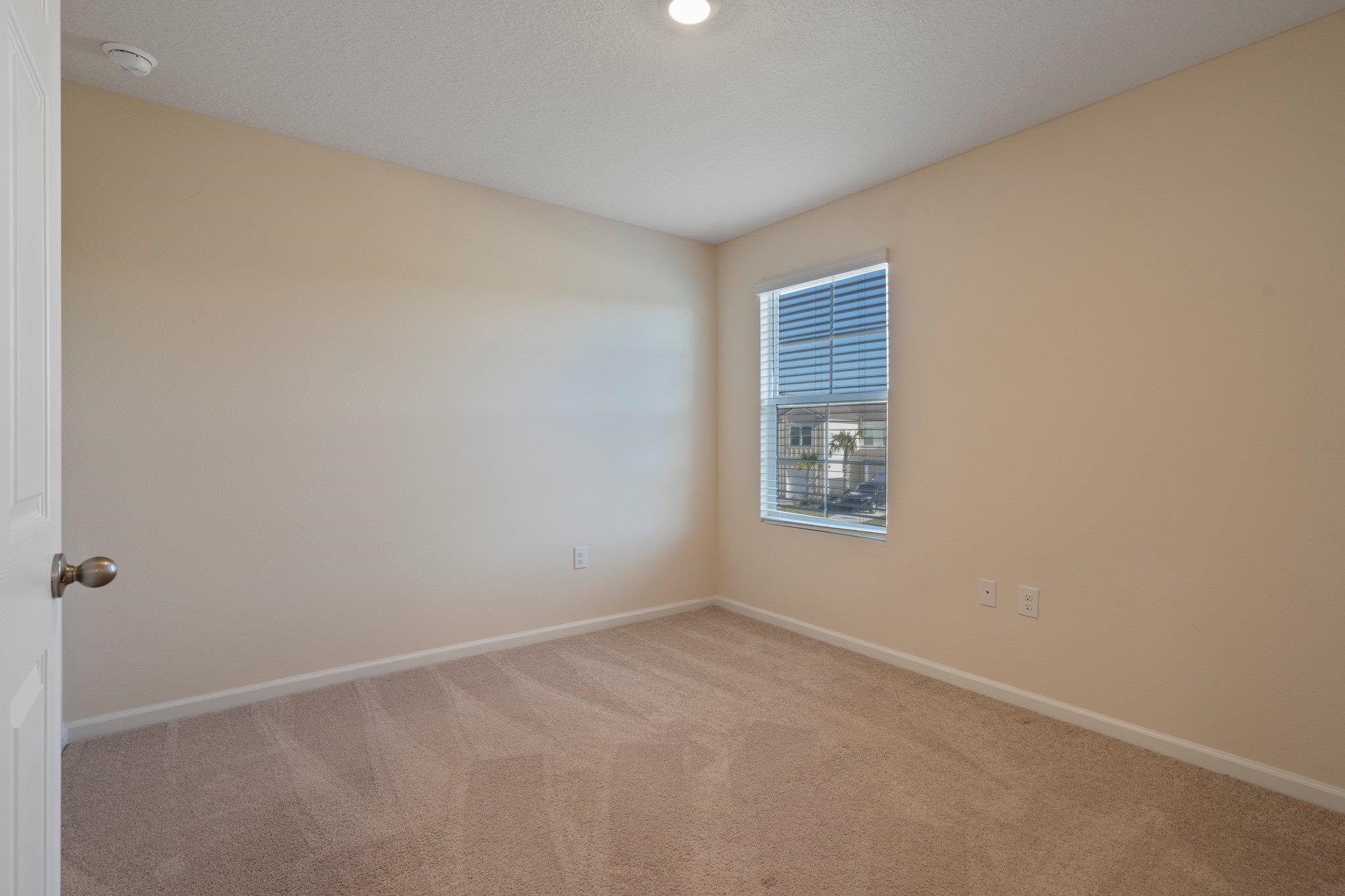 553 Coastline Way Street St. Augustine, FL 32092 - Photo 19 of 35 an empty room with a window