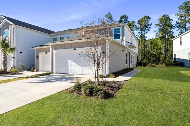 a kitchen with stainless steel appliances a refrigerator sink and cabinets