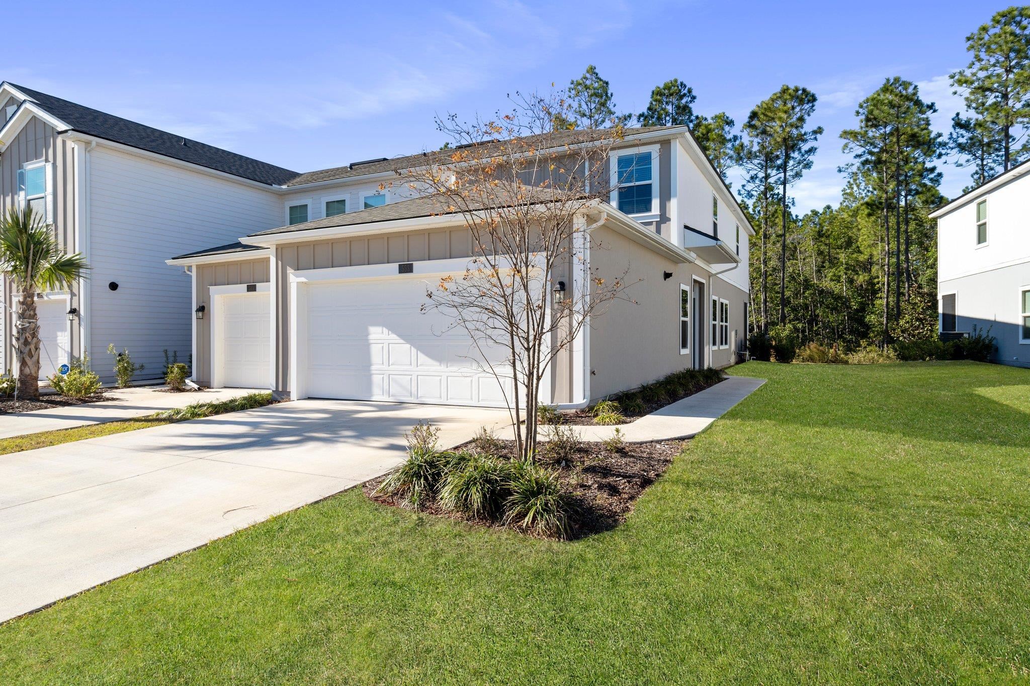 553 Coastline Way Street St. Augustine, FL 32092 - Photo 2 of 35 a view of a house with a yard