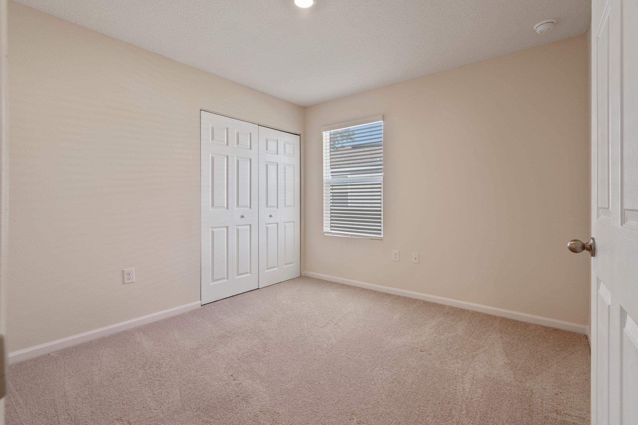 553 Coastline Way Street St. Augustine, FL 32092 - Photo 22 of 35 an empty room with windows