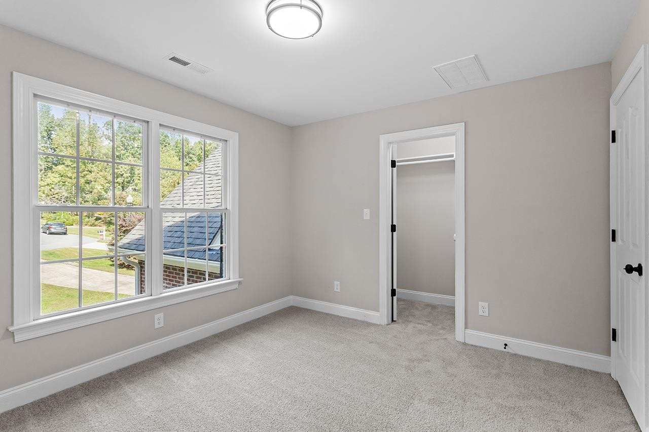 170 Fleming Forest Drive Youngsville, NC 27596 - Photo 24 of 42 a view of an empty room with a window