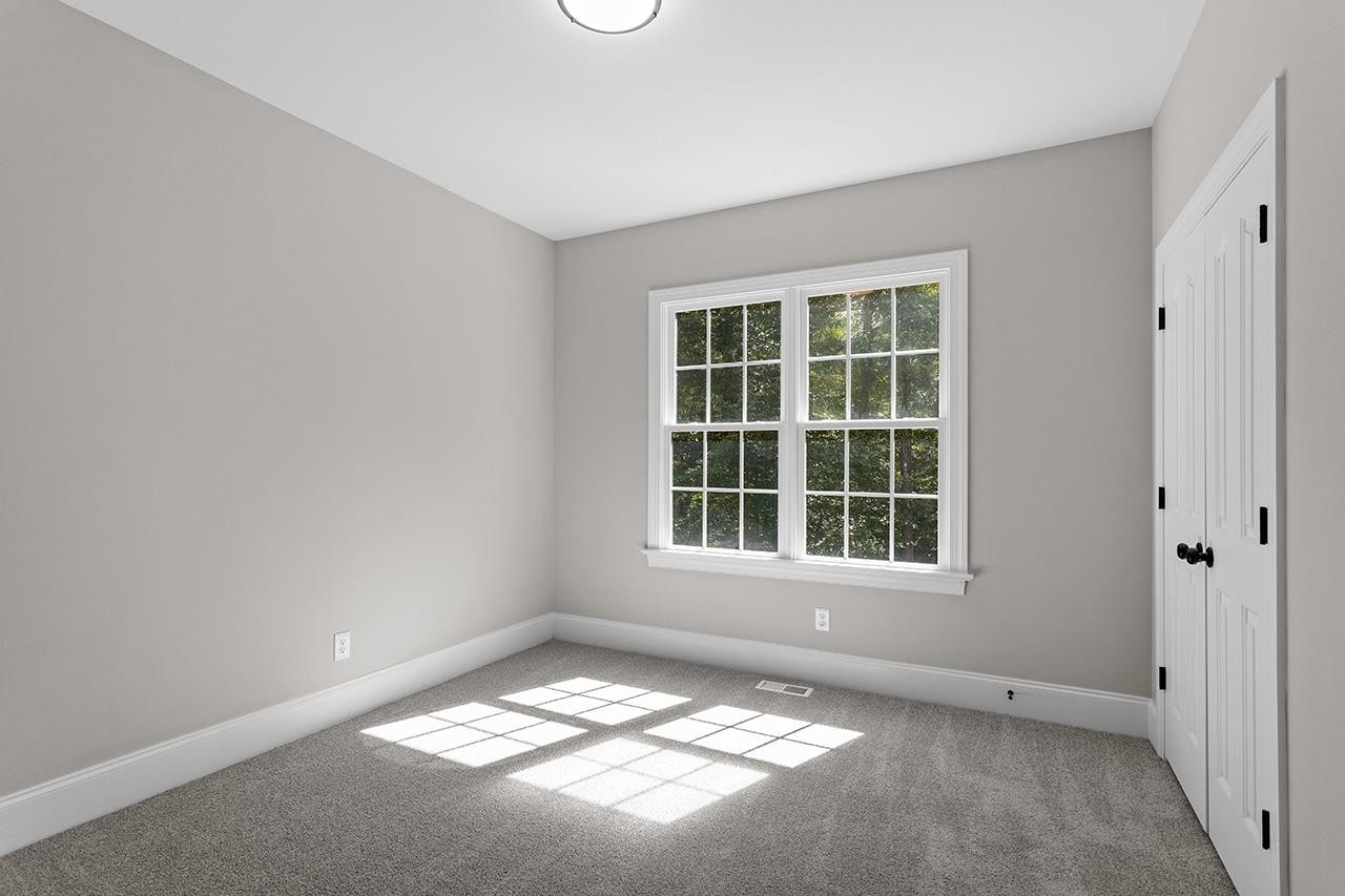 170 Fleming Forest Drive Youngsville, NC 27596 - Photo 26 of 42 an empty room with a window
