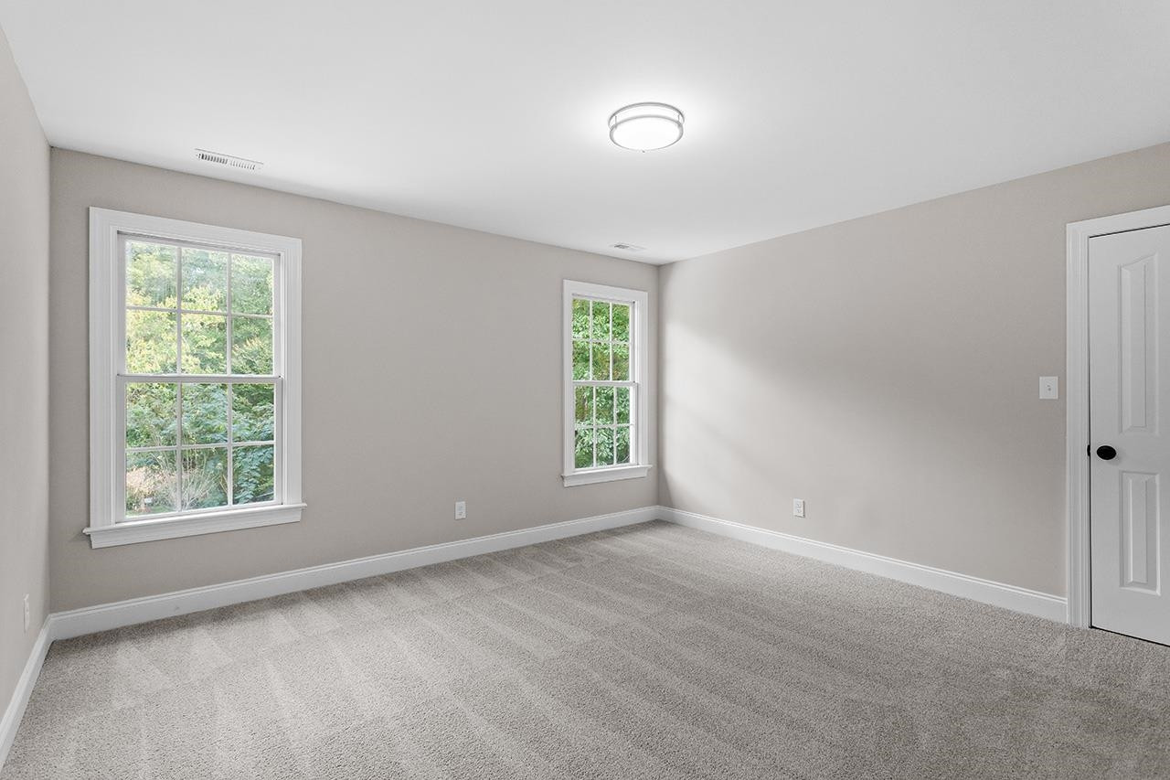 170 Fleming Forest Drive Youngsville, NC 27596 - Photo 27 of 42 a view of an empty room with a window