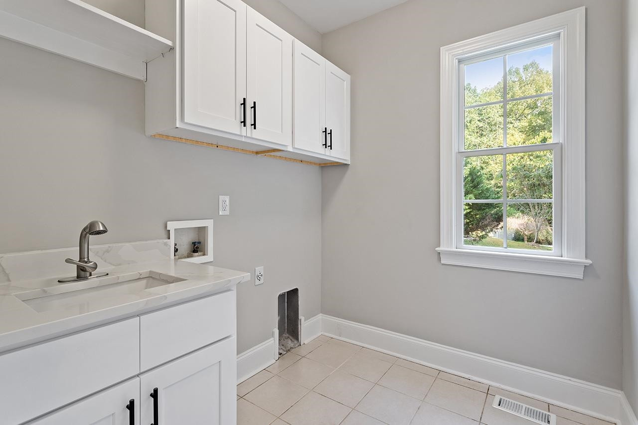 170 Fleming Forest Drive Youngsville, NC 27596 - Photo 34 of 42 a bathroom with a sink toilet and vanity