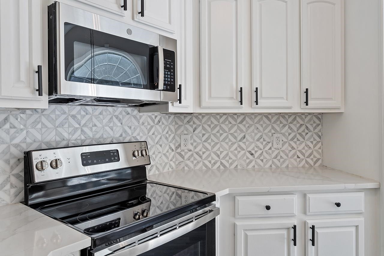 170 Fleming Forest Drive Youngsville, NC 27596 - Photo 10 of 42 a stove top oven sitting inside of a kitchen
