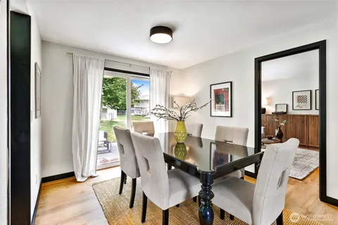 a view of a dining room with furniture window and outside view