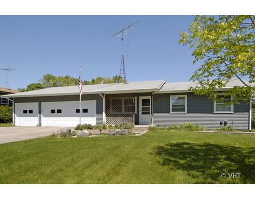 a front view of house with yard and seating area
