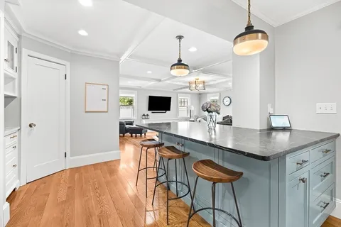 a kitchen with a table and chairs in it