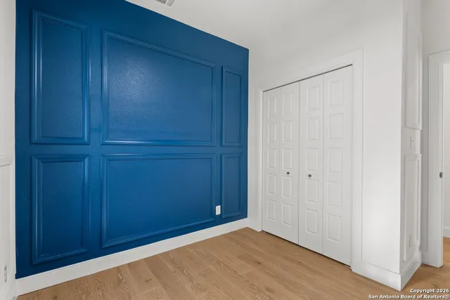 an empty room with closet area