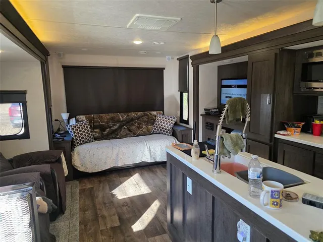 a bedroom with a bed and a mirror